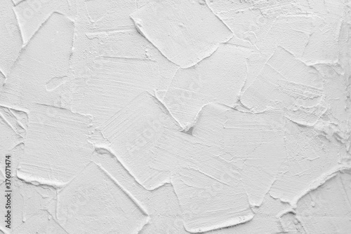 White wall of the building. Rough plaster surface. Abstract background.
