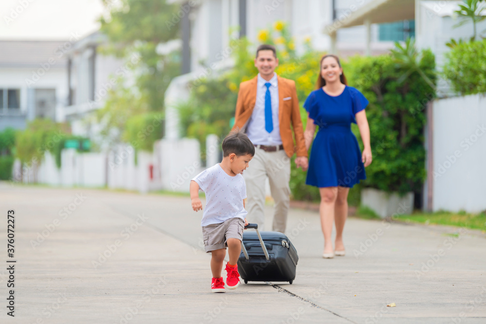 Portrait of Successful asian family with son move to new house.