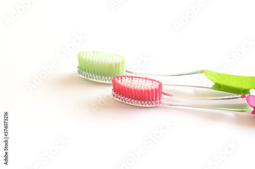 Ecological plastic toothbrushes isolated on the white. Teeth care  life style.