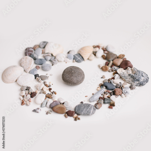 Soap with seashells and stones on a white background. Spa or wellness setting. Top view mockup