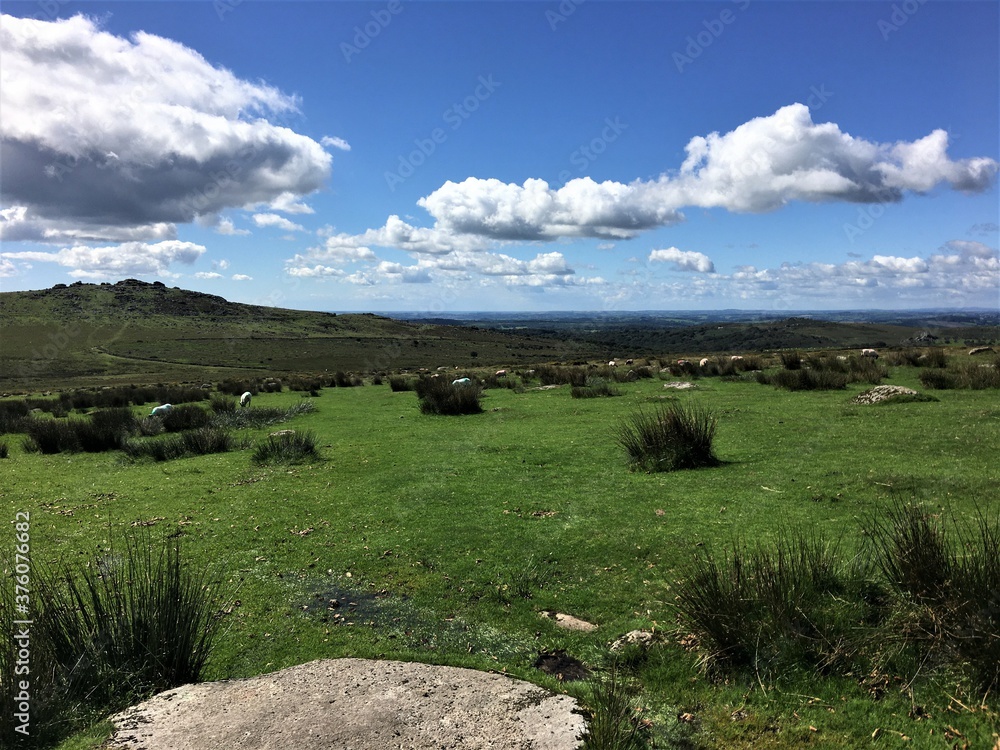 A view of Dartmoor National Park from the summit showing blue skies A view of Dartmoor National Park from the summit showing blue skies