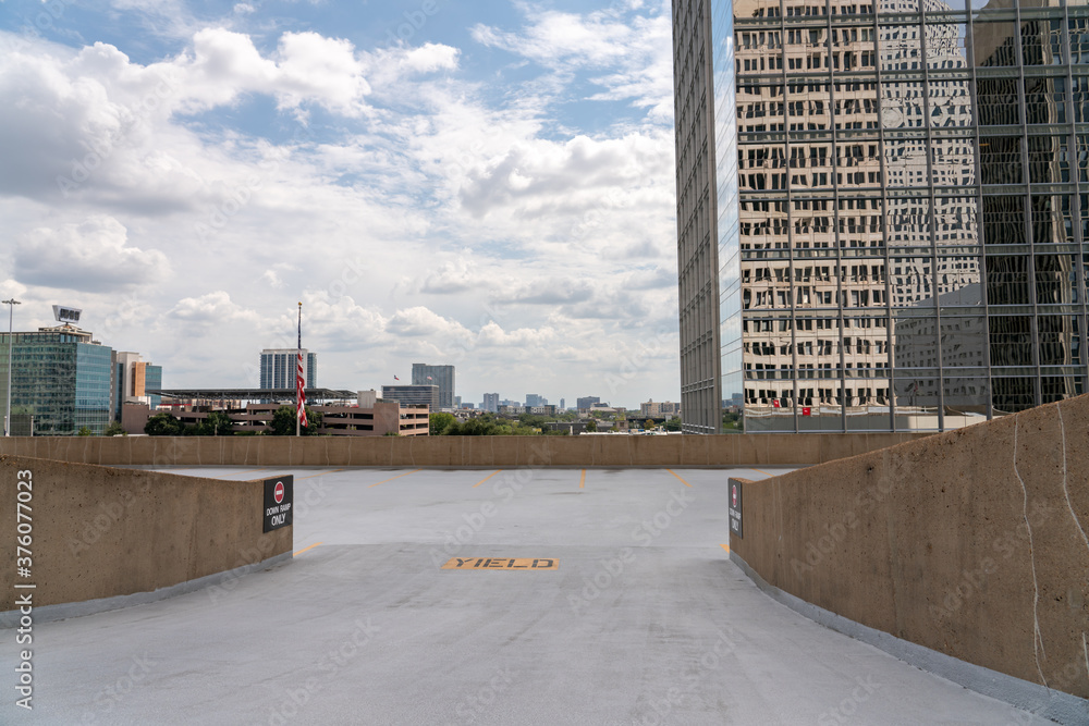 Driving Down Ramp on Roottop Parking With Houston Skyline in the ...