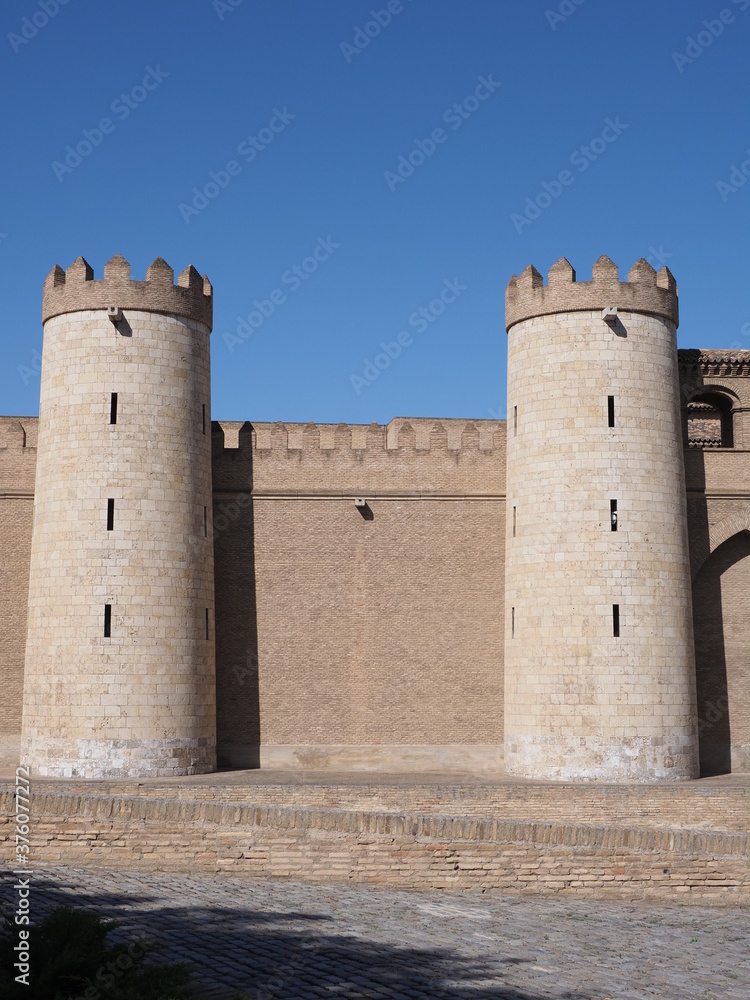 Two towers of palace in Saragossa city in Spain - vertical