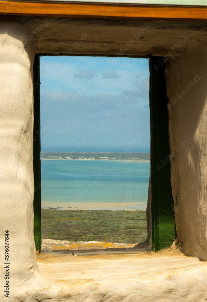 view from old window onto turquoise lake sea lagoon view from old window onto turquoise lake sea lagoon