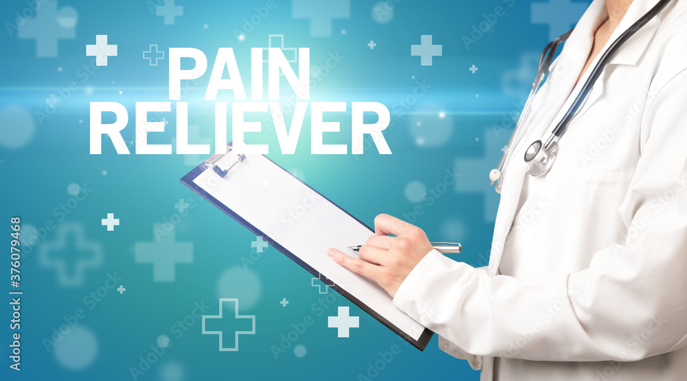 doctor writes notes on the clipboard with PAIN RELIEVER inscription, first aid concept doctor writes notes on the clipboard with PAIN RELIEVER inscription, first aid concept