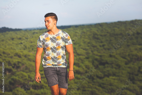 Young caucasian man at the top of Dune de Pila sand dune at Arcachon, Aquitanie, France. photo