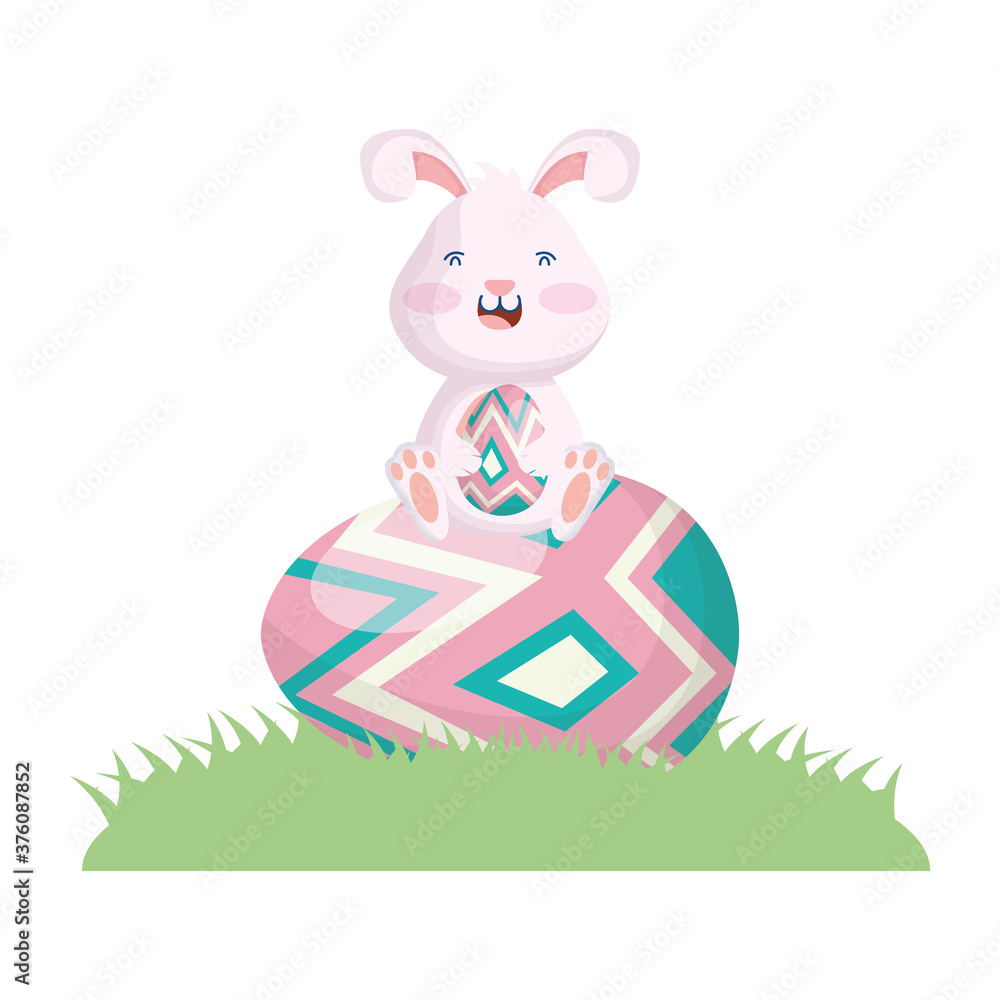 cute easter little rabbit seated in egg painted grass scene cute easter little rabbit seated in egg painted grass scene
