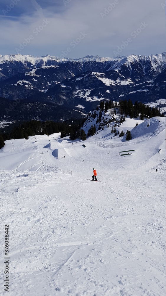 Skiing in the beautiful mountains of the Laax ski resort in Flims, Switzerland