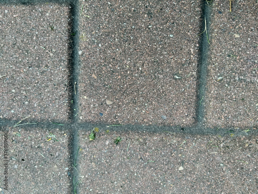 Fototapeta premium asphalt road texture with concrete blocks