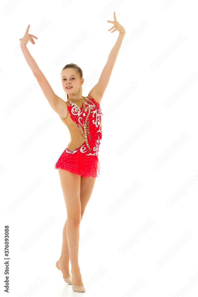 Cute little girl gymnast getting ready to perform a difficult exercise. Cute little girl gymnast getting ready to perform a difficult exercise.