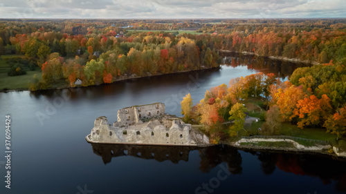 Autumn Aerial Landscapeof Old Koknese Castle Ruins and River Daugava Located in Koknese Latvia. Medieval Castle Remains in Koknese. Aerial View of an Old Stone Castle Ruins in Koknese photo