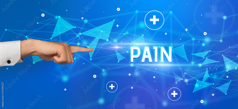 Close-Up of cropped hand pointing at PAIN inscription, medical concept Close-Up of cropped hand pointing at PAIN inscription, medical concept