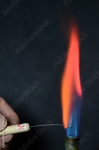 Colored fire caused by an element. Strontium causes a red color.