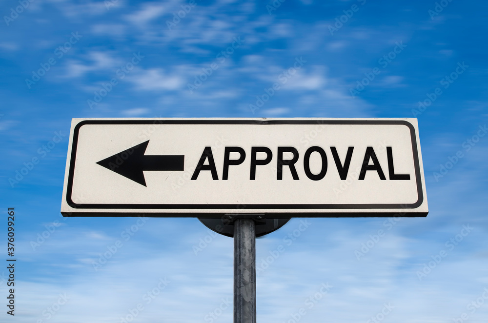 Approval road sign, arrow on blue sky background. One way blank road sign with copy space. Arrow on a pole pointing in one direction.