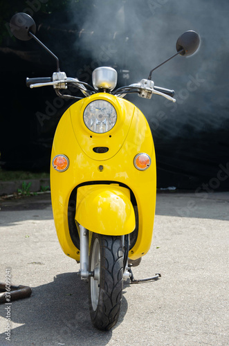 Yellow retro scooter. Scooter background.