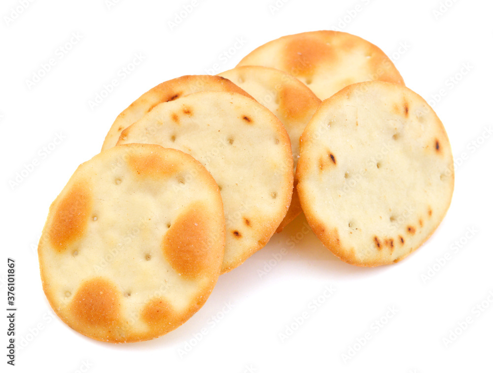 A stack of cheesy rice crackers on a white background. A stack of cheesy rice crackers on a white background.