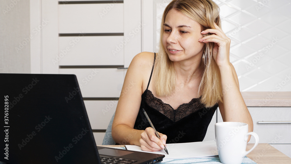 Entrepreneur or student working or studying at home and writing notes at home Entrepreneur or student working or studying at home and writing notes at home