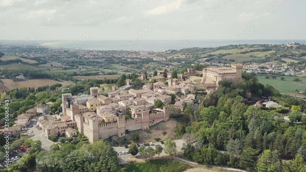Italy, August 2020 - aerial and panoramic view of the medieval village of Gradara taken by the drone. Gradara is located in the province of Pesaro in the Marche region Italy, August 2020 - aerial and panoramic view of the medieval village of Gradara taken by the drone. Gradara is located in the province of Pesaro in the Marche region