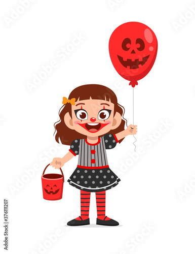 happy cute little kid boy and girl celebrate halloween wears clown costume