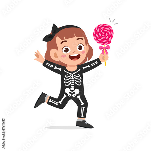 happy cute little kid boy and girl celebrate halloween wears skeleton costume