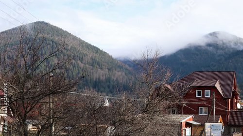 A small town or village of Yaremche among the Carpathians on an autumn afternoon.  photo