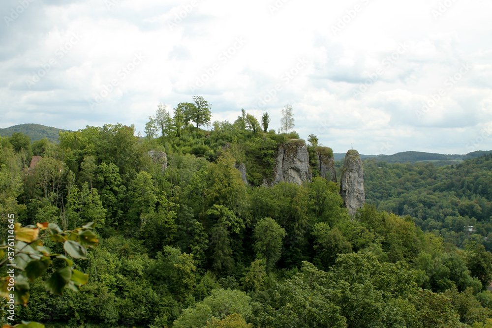 Rocks in the green forest photographed in Germany