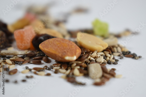 different views of nuts and seeds on a white background © Santiago