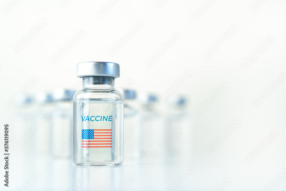 Transparent vials with USA flag. Vaccine for covid-19 coronavirus, flu, infectious diseases. Injection after clinical trials for vaccination of human, child, adult, senior. Medicine, drug concept Transparent vials with USA flag. Vaccine for covid-19 coronavirus, flu, infectious diseases. Injection after clinical trials for vaccination of human, child, adult, senior. Medicine, drug concept