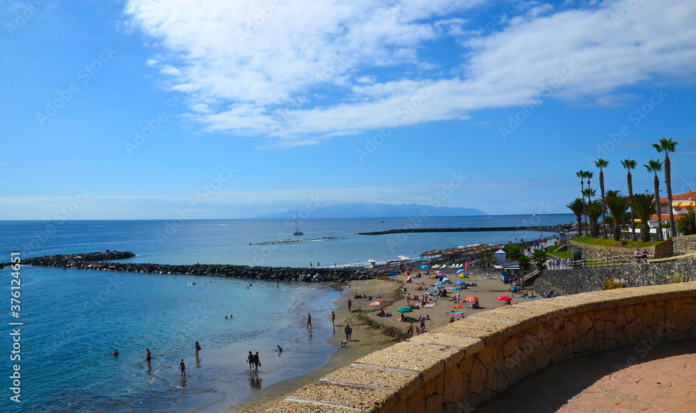 Coastal view of playa El Duque beach in Costa Adeje,Tenerife,Canary Islands,Spain.Travel or vacation concept.Selective focus. Coastal view of playa El Duque beach in Costa Adeje,Tenerife,Canary Islands,Spain.Travel or vacation concept.Selective focus.