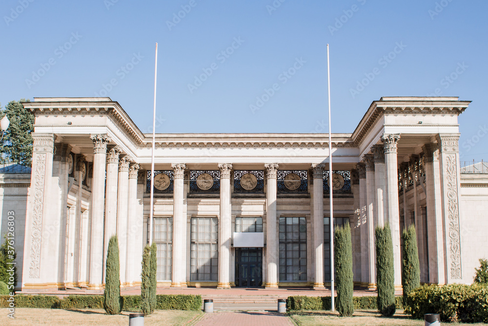 Fototapeta premium old building with columns in park on a clear day