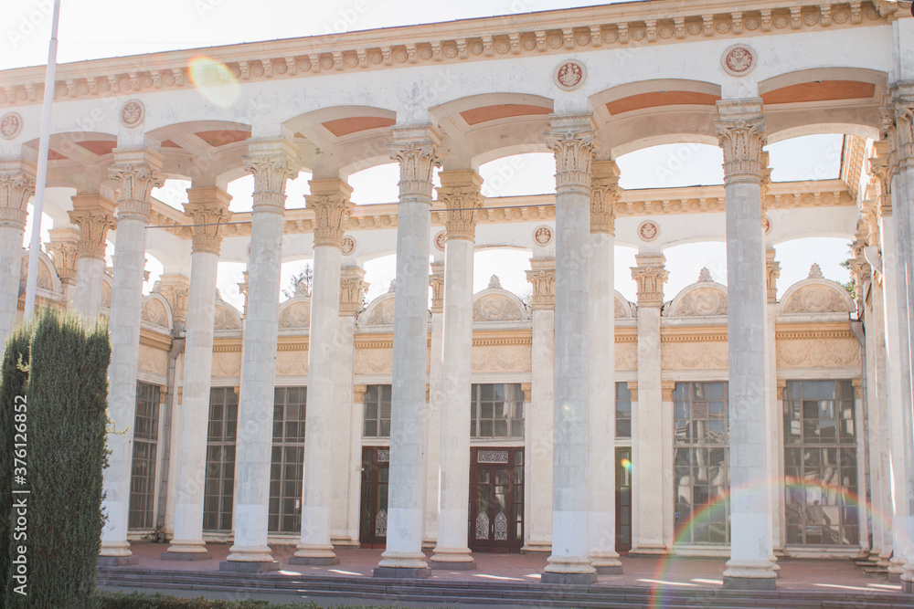 Fototapeta premium old building with columns in park on a clear day