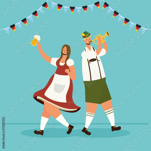 german couple wearing tyrolean suit drinking beers and playing trumpet