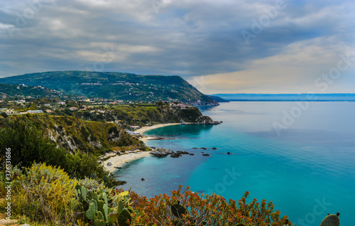 coast in southern italy with cloudy sky and turquoise water