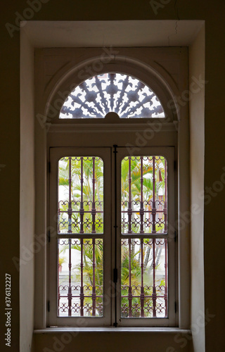 Ancient window with grid