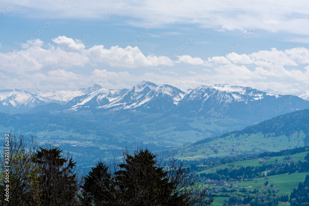 Snow covered mountain range in the Voralberg land of Austria, on a cloudy day