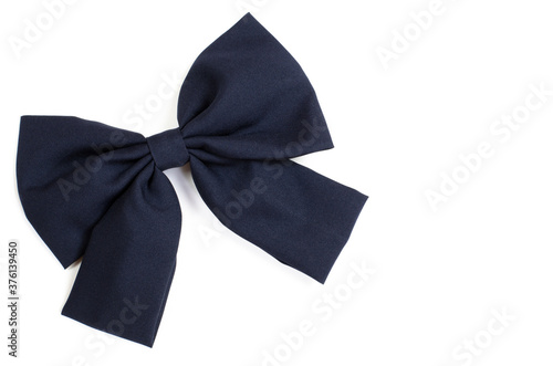 Children's bow of blue cotton on a white background. Isolate. Blue hair bow