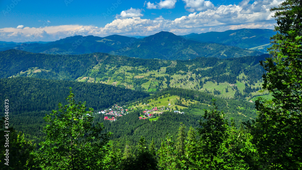 Panorama of Durau village - a small countryside type settlement located in Ceahlau Mountains, Carpathia, Romania
