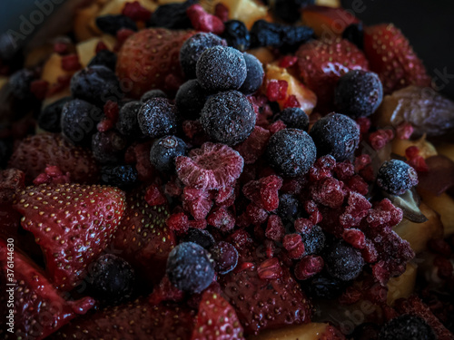 Close up of frozen mixed fruit - berrie - red currant  raspberry  strawberry  blackberry  blueberry