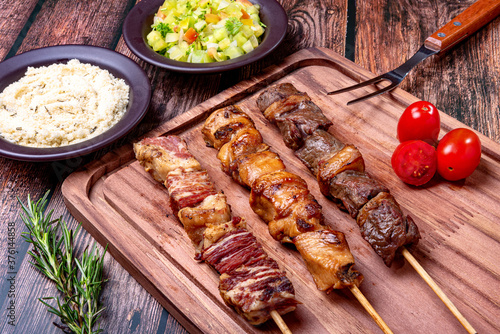 Kebab - Grilled meat on a cutting board, with flour and vinaigrette salad