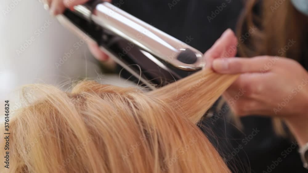 Beautiful woman getting her hair done in the barbershop. Beautiful woman getting her hair done in the barbershop.