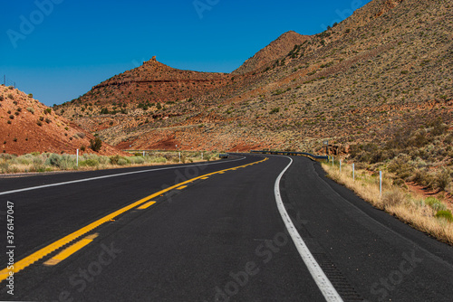 Empty scenic highway in Arizona, USA. Panoramic skyline with empty road.