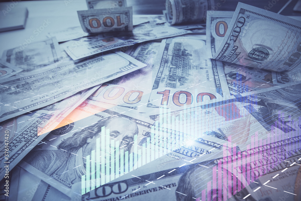 Fototapeta premium Multi exposure of forex chart drawing over us dollars bill background. Concept of financial success markets.
