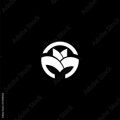 M letter logo in circle formation, Double M. Abstract logo on black background.