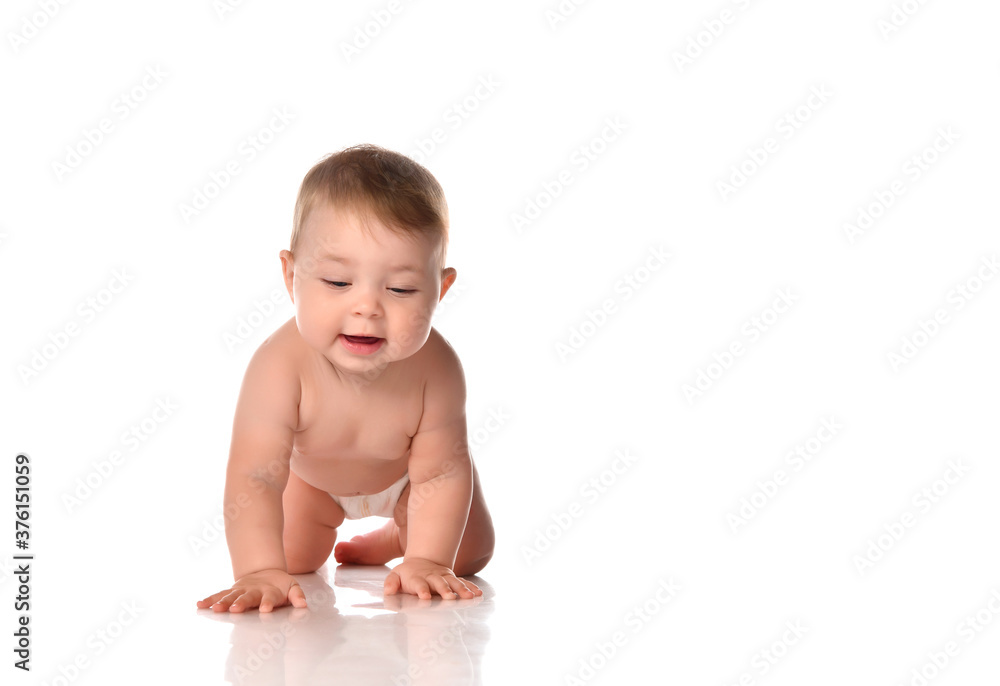 Little baby child smiling and crawling isolated on white in studio. Little baby child smiling and crawling isolated on white in studio.