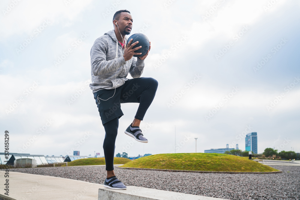 Athletic man training with medicine ball. Athletic man training with medicine ball.
