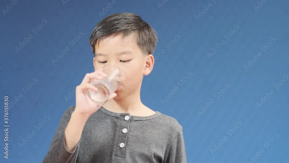 4k Young Asian boy drink water from a glass
4k Young Asian boy drink water from a glass