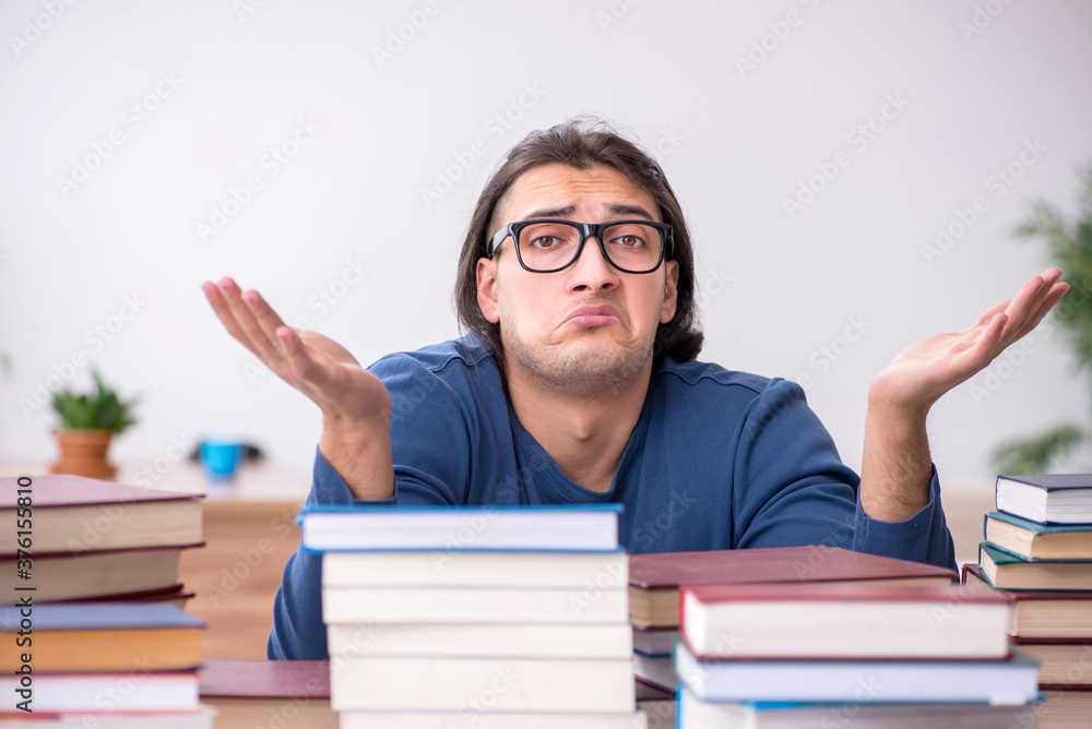 Young male student preparing for exams at home Young male student preparing for exams at home