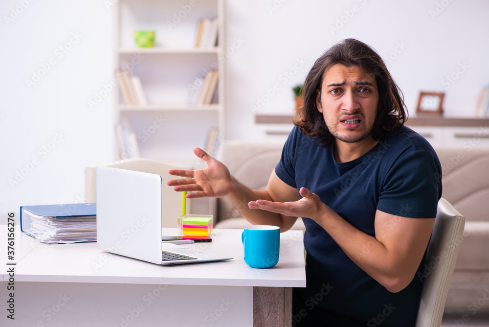 Young man employee working from house Young man employee working from house