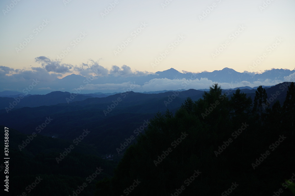 Blue sky above high mountain landscape in daytime, Japanese alps, Hakuba, Japan