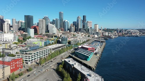 Drone footage of the cruise terminal, Bell harbor marina in Seattle downtown, waterfront, piers, empty Alaskan Way with skyscrapers, during the pandemic photo